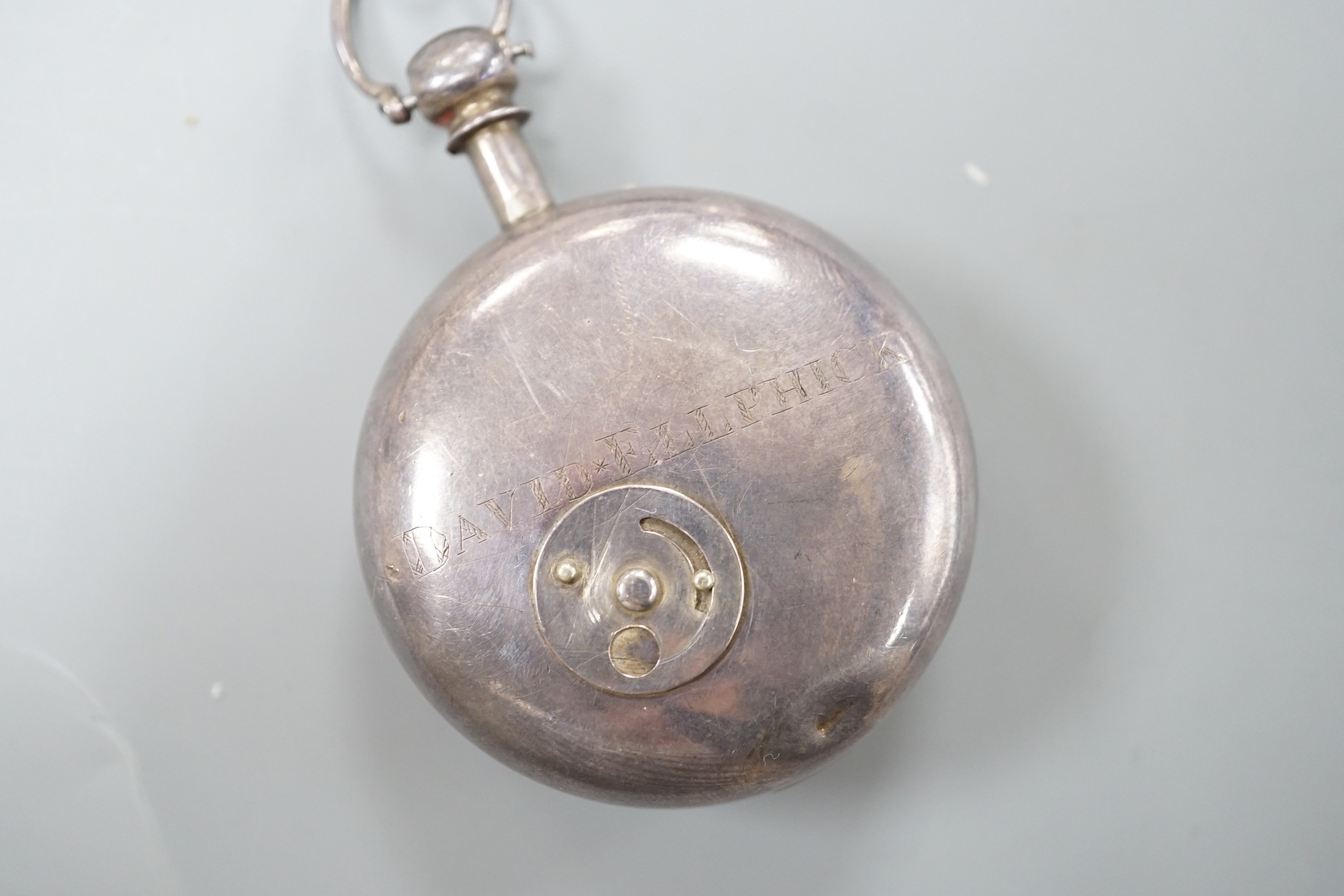 A George IV silver keywind verge pocket watch, by Tanner of Hailsham, with Arabic dial and engraved name verso, case diameter 51mm, with key, (missing outer case?).